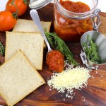 a jar with homemade tomato sauce, tomatoes and bread