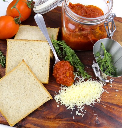 a jar with homemade tomato sauce, tomatoes and bread