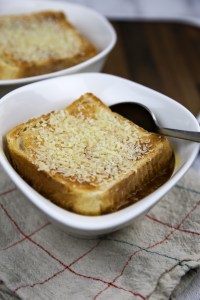 a bowl with vegan french onion soup on cloth